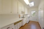 Spacious and convenient laundry room with high capacity washer  dryer
